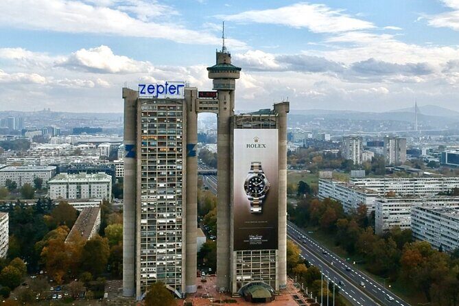 E-Scooter Communist Yugoslavia Tour - Stop 1: Western City Gate and Genex Tower (20 minutes, free)